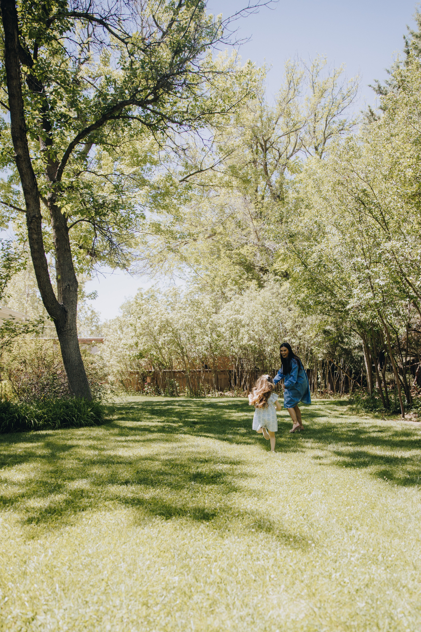 Erica Reed with her child in a garden